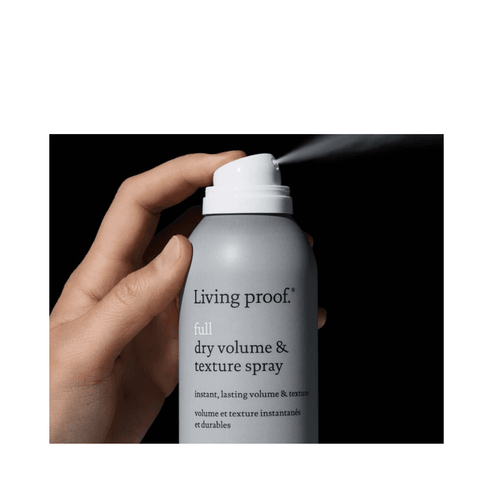 Close-up of Full Dry Volume Spray being dispensed from the can. Delivers instant volume and texture for quick, stylish hair transformations.