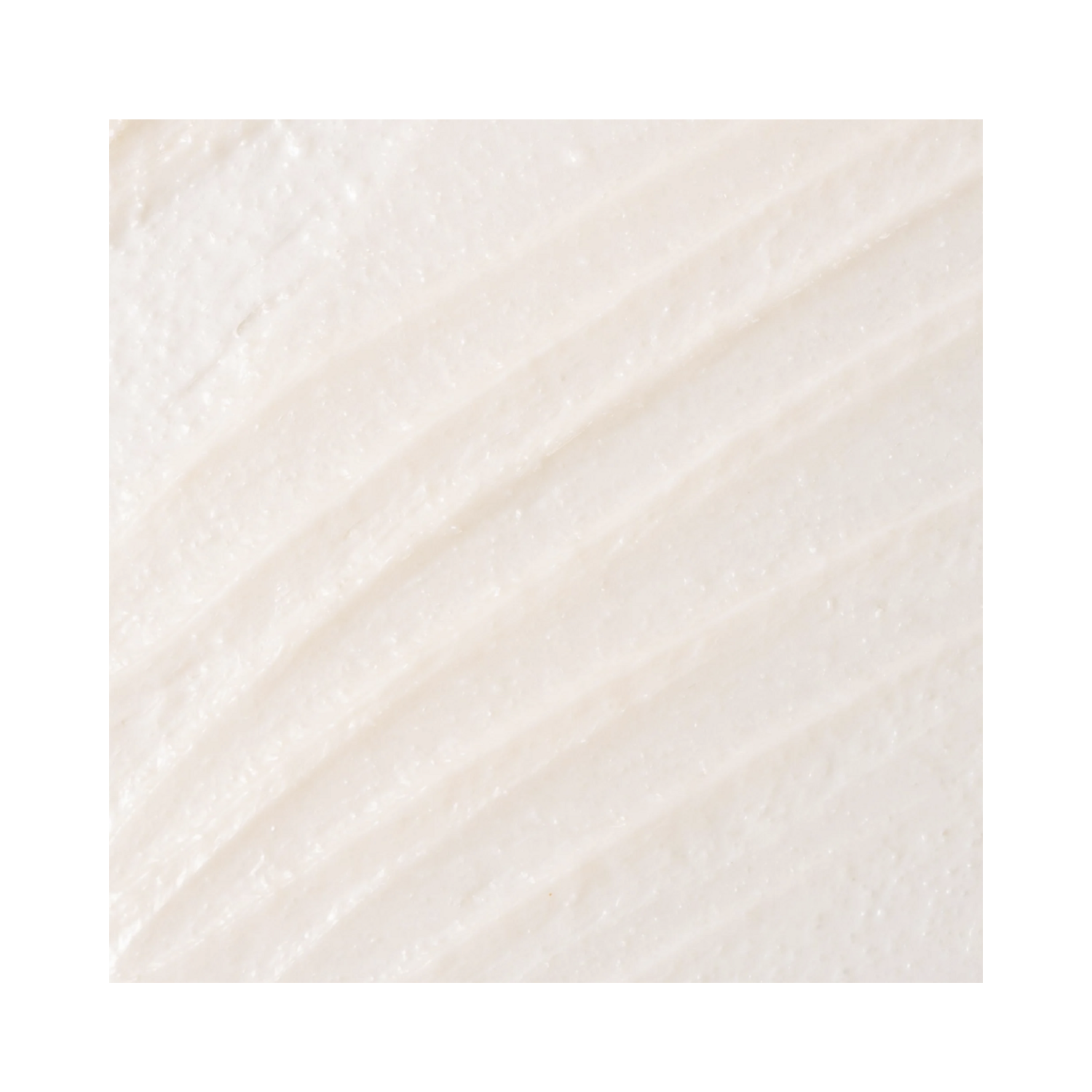 Close-up of CosMedix Glow Mask texture showing fine exfoliating particles. Designed to improve skin tone and texture.