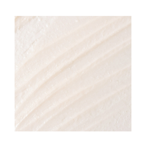 Close-up of CosMedix Glow Mask texture showing fine exfoliating particles. Designed to improve skin tone and texture.