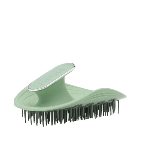 Manta Hair Brush in mint green with flexible bristles and ergonomic handle, ideal for gentle haircare across all hair types.