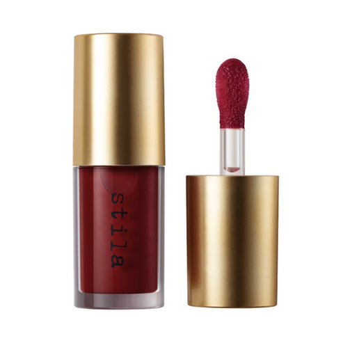 Stila Gel Lip Oil in fuchsia pink, offering vibrant color and hydration in a stylish gold and clear tube.
