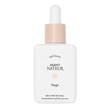 Agent Nateur Holi (Sun) Dewy Tinted Serum SPF 50 in Beige with dropper bottle packaging, offering broad-spectrum sun protection and lightweight coverage.