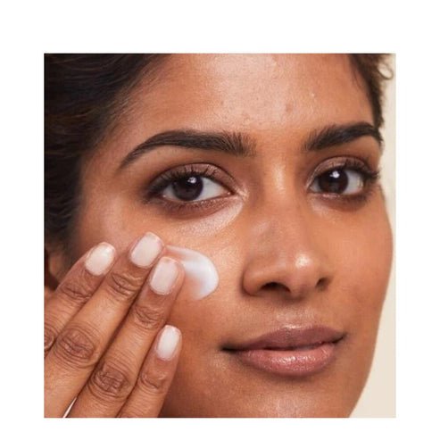 Model using Dr Dennis Gross Hyaluronic Marine Cleanser on face, demonstrating its gentle, non-drying cleansing action.