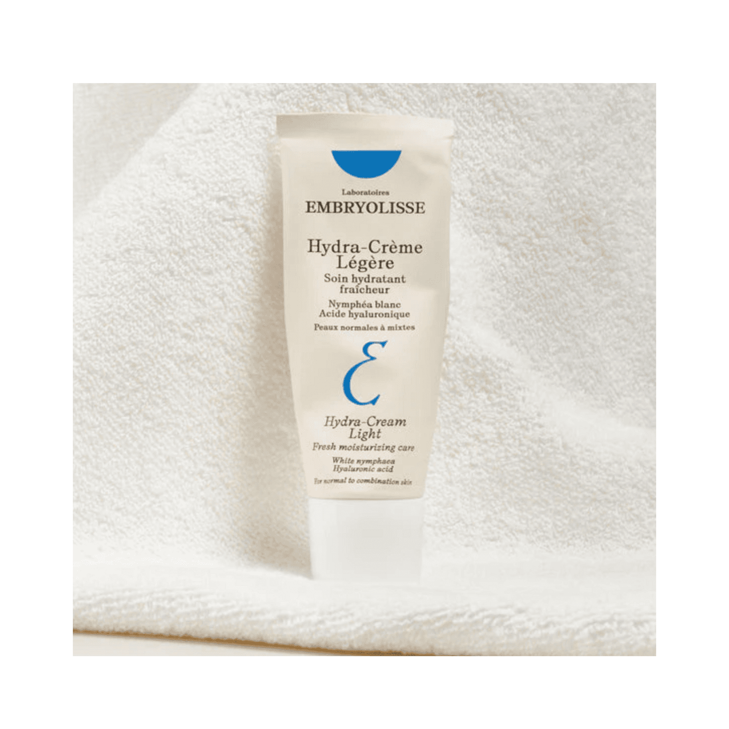 Hydra Cream Moisturizer by Embryolisse displayed on soft towel background. Delivers water replenishment and hydration for dry or combination skin.