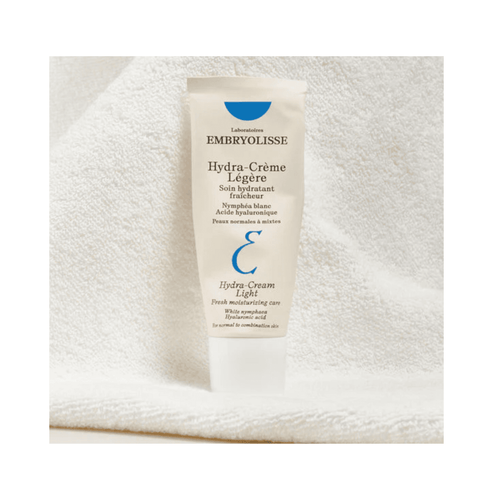 Hydra Cream Moisturizer by Embryolisse displayed on soft towel background. Delivers water replenishment and hydration for dry or combination skin.