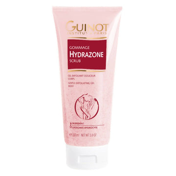 Guinot Hydrazone Exfoliating Scrub in a 5.9 oz pink tube for soft, smooth skin. Ideal body scrub for 24-hour hydration and gentle exfoliation.