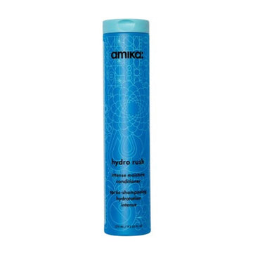 Amika Hydro Rush Conditioner in a tall blue bottle with geometric design, ideal for dry hair needing 3x hydration and intense moisture care.