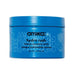 Primer plano de la textura de Amika Hydro Rush Intense Moisture Mask, que muestra su fórmula rica y cremosa para una hidratación profunda del cabello.