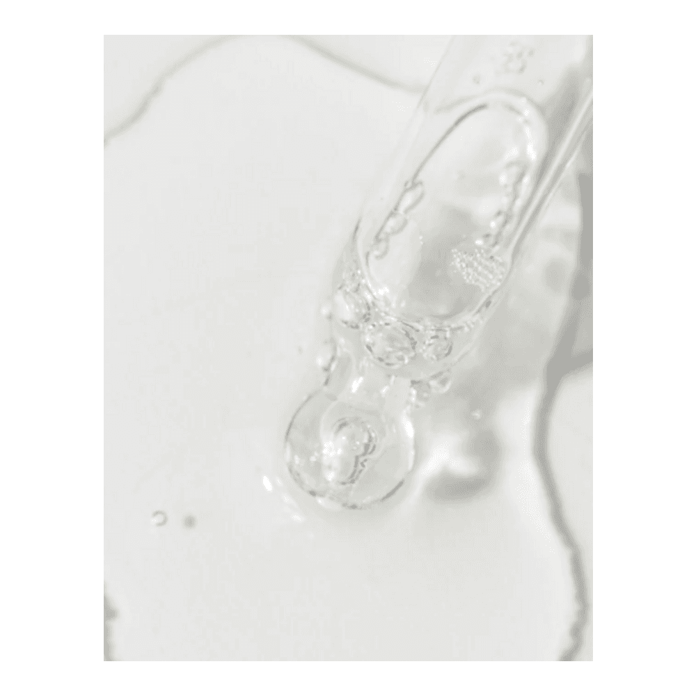 Close-up of VivierSkin Kine-C Serum texture with dropper, showcasing its lightweight, hydrating formula for facial treatment.