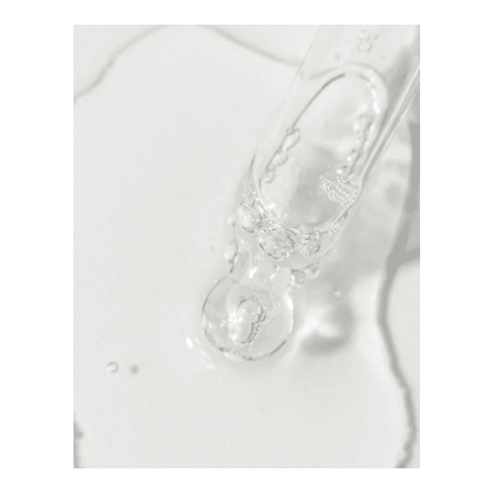 Transparent drop of VivierSkin Kine-C Serum on skin, highlighting its smooth, absorbent texture ideal for mature skin treatment.