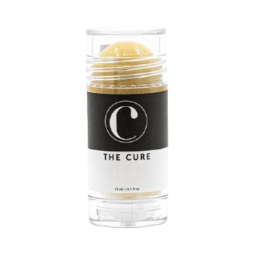 Cure Skincare Lip Balm in clear twist-up tube with black and white label. Hydrating lip balm for dry, chapped lips with long-lasting vegan formula.