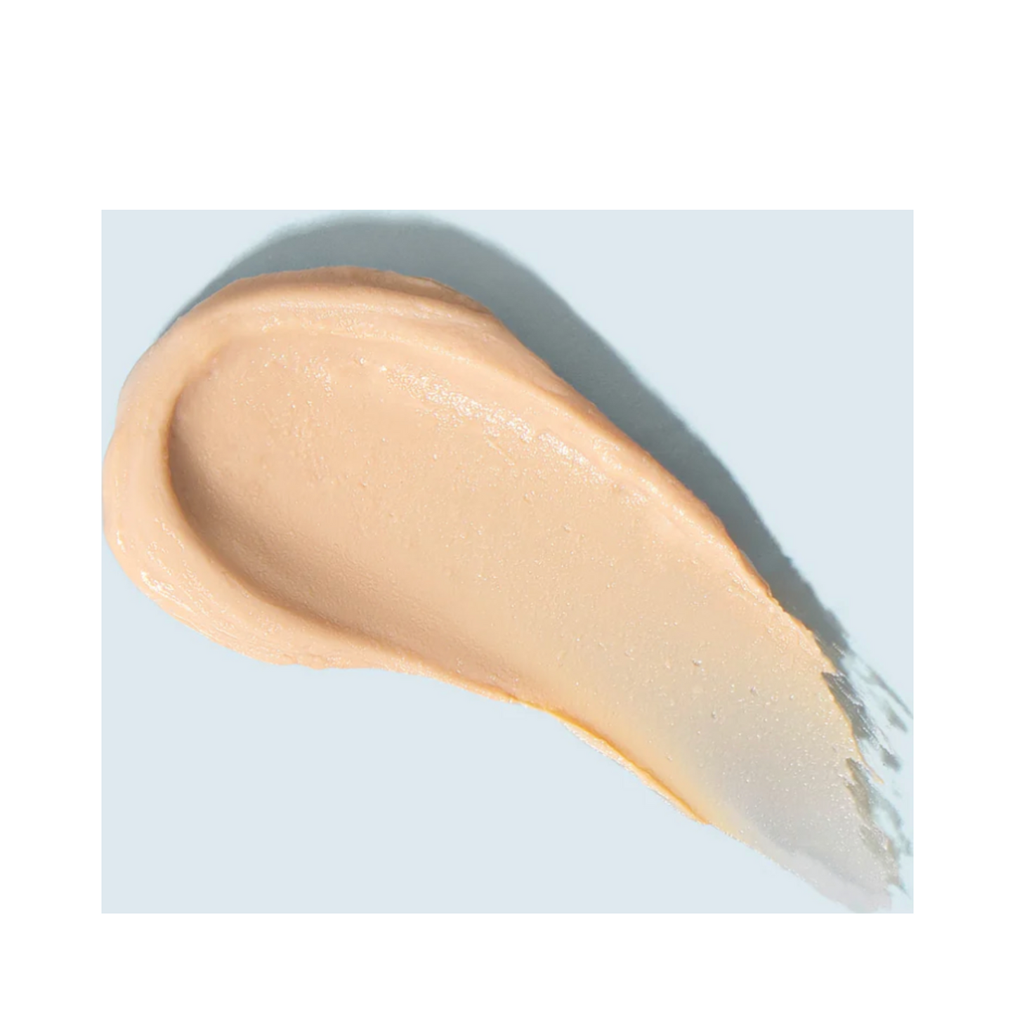 Swatch of TiZO Mineral Stick Tinted sunscreen showing creamy, tinted consistency for even skin tone coverage.