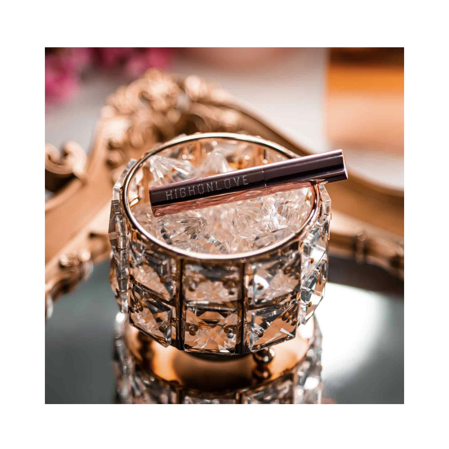 High on Love Mini Lip Gloss displayed on crystal dish, luxury lip balm & treatment product from eSkinStore.