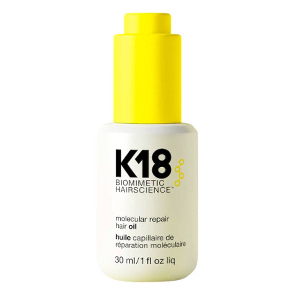 K18 Molecular Repair Hair Oil 30ml bottle with yellow cap, designed to smooth frizz and strengthen hair using biomimetic repair technology.