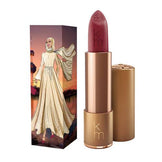 Karen Murrell Lipstick - Natural Nude Lipstick | 4 ml / 0.14 oz in bold red with tropical-themed box showing a woman in a yellow ruffled dress.