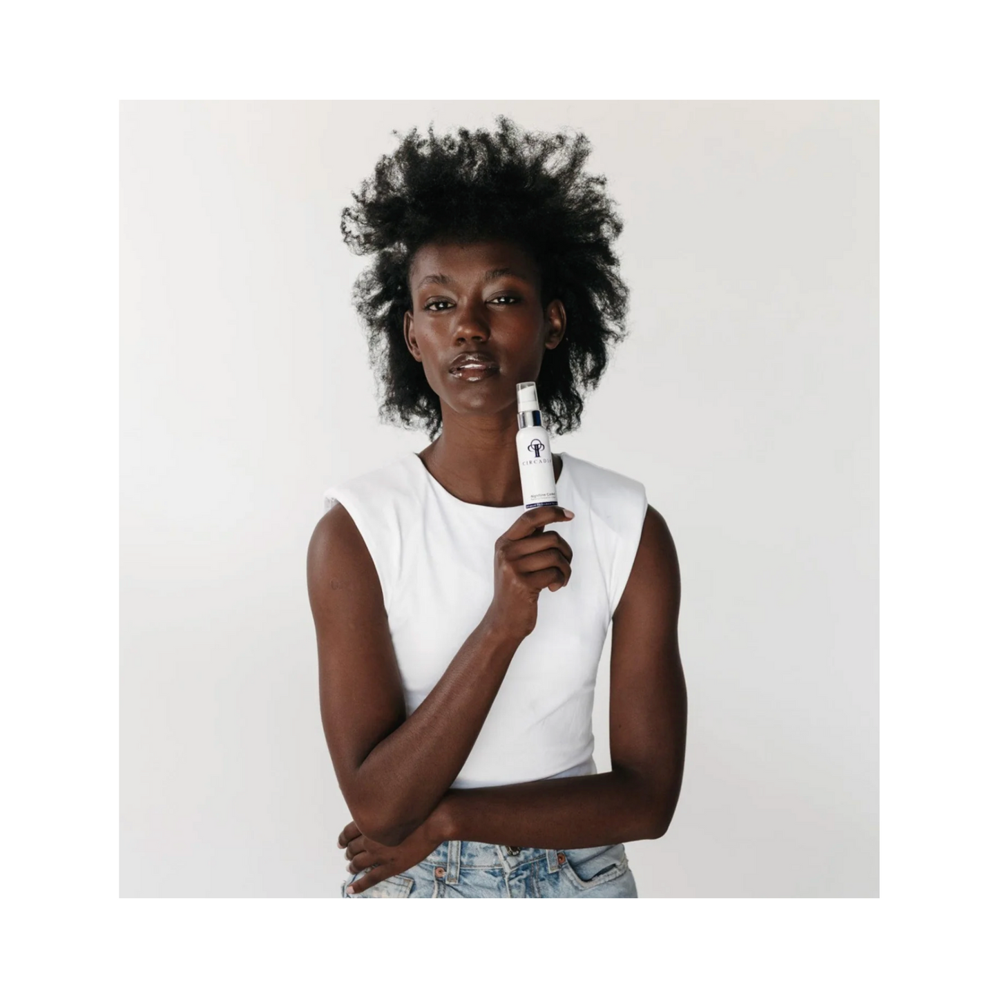 Model holding Circadia Night Time Control 2 oz acne treatment serum, ideal for nighttime skincare routine. Shop now at eSkincareStore.