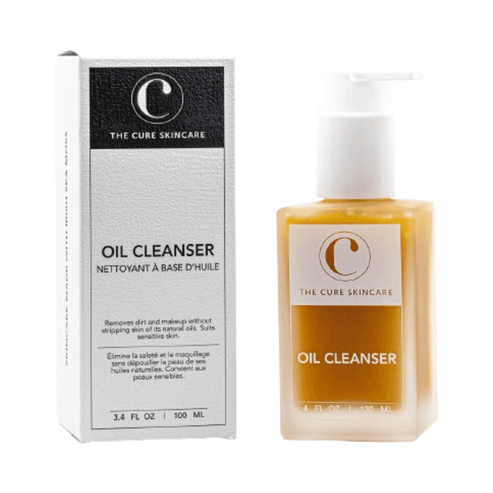 Skincare Oil Cleanser by The Cure Skincare shown with packaging box, a gentle face wash cleanser for all skin types and dry skin concerns.