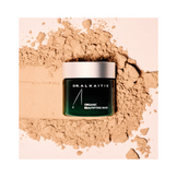 Dr Alkaitis Organic Beautifying Mask placed on powdered exfoliant, ideal for anti-aging and nourishing sensitive and dry skin.