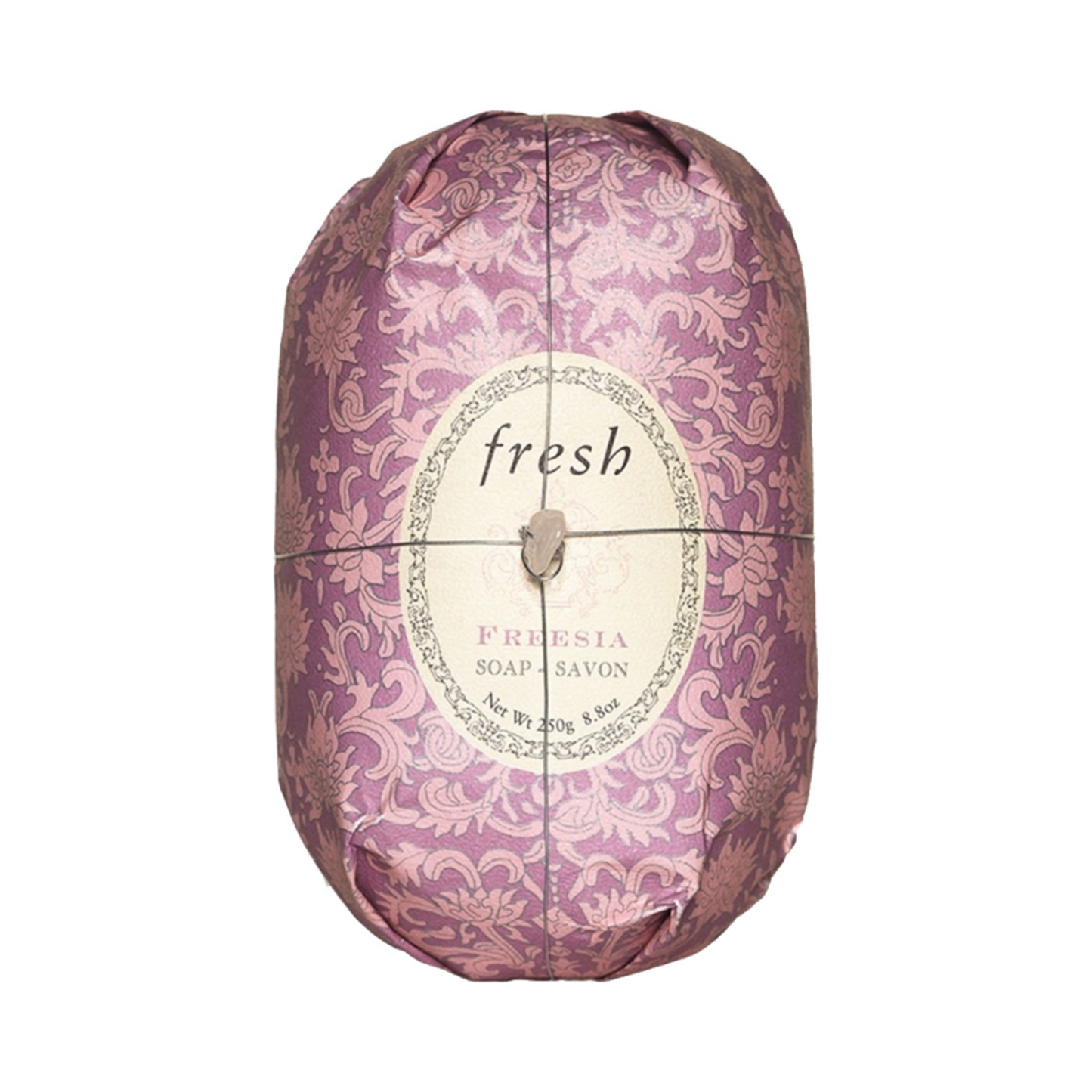 Shea butter-infused Fresh Oval Soap - Freesia in decorative packaging, perfect for nourishing skin in bath and shower routines.