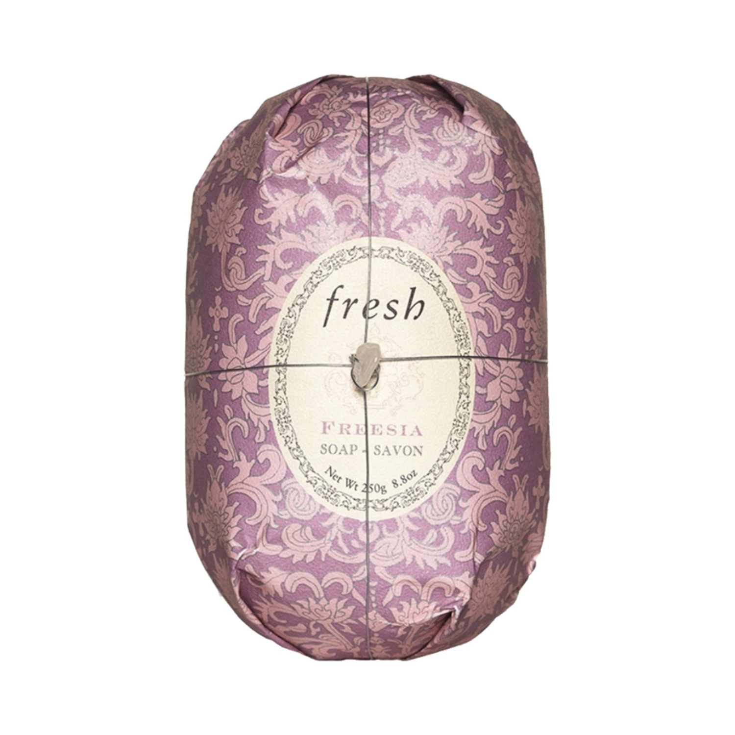 Shea butter-infused Fresh Oval Soap - Freesia in decorative packaging, perfect for nourishing skin in bath and shower routines.