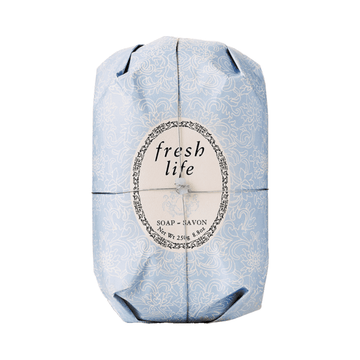 Fresh Oval Soap - Fresh Life wrapped in elegant blue floral paper, a vegetable-based body soap with shea butter for moisturizing skin.