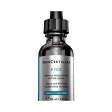 Close-up of SkinCeuticals P-TIOX serum bottle showing bilingual label, highlighting wrinkle-correcting peptide formula for facial care.