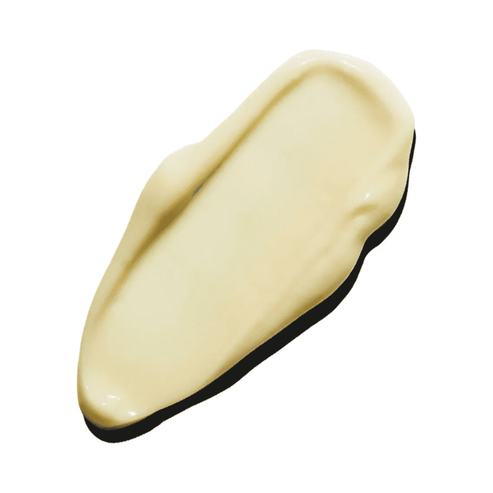 Creamy texture of Peptides & Omegas Firming Eye Cream shown in a smooth beige swatch, ideal for moisturizing and firming under-eye skin.