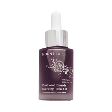 Mount Lai Plant Root Remedy Balancing Facial Oil in a dark purple glass bottle with silver dropper cap. Ideal for dry skin and natural glow.