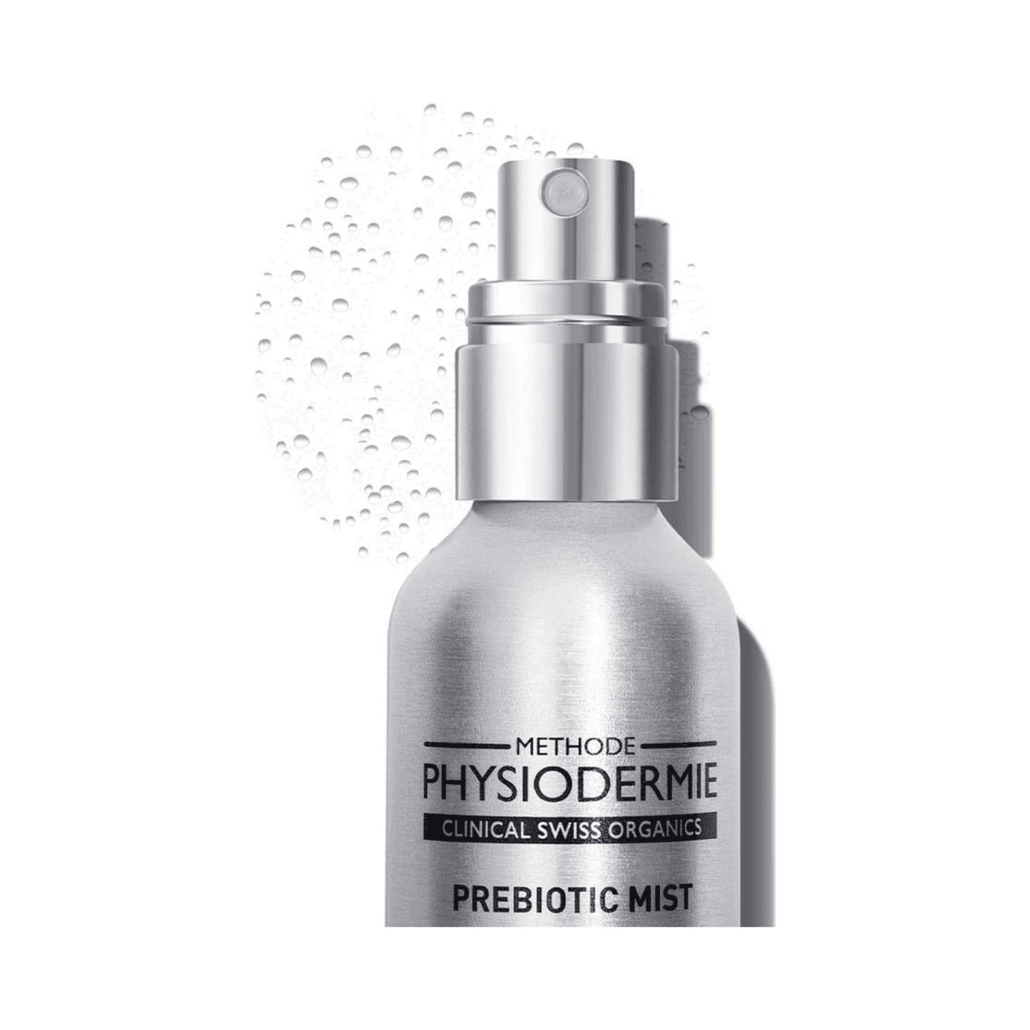 Close-up of Physiodermie Prebiotic Mist Antioxydant Face Mist nozzle with visible mist droplets, highlighting product texture and packaging.