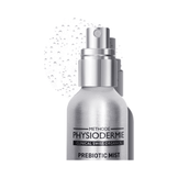 Close-up of Physiodermie Prebiotic Mist Antioxydant Face Mist nozzle with visible mist droplets, highlighting product texture and packaging.