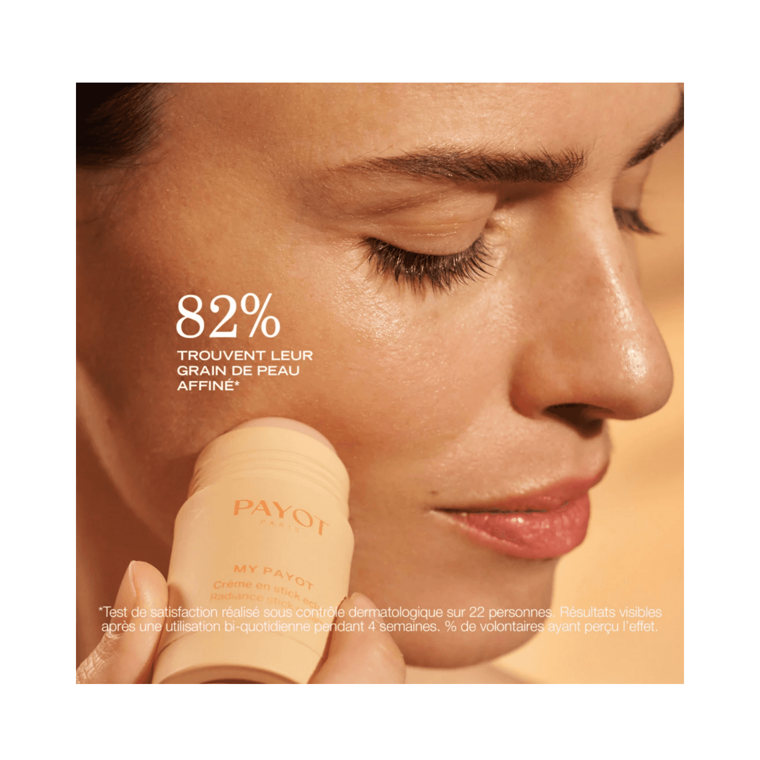 Woman applying Payot Radiance Stick Cream - Enhance Your Glow | Antioxidants to face, showing smooth skin texture improvement with 82% satisfaction rate.