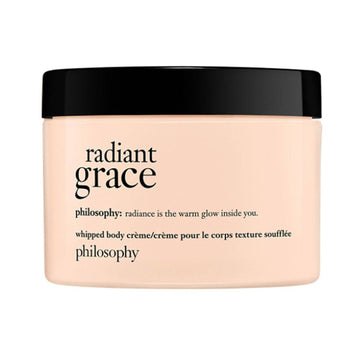 Philosophy Radiant Grace Whipped Body Creme in a peach jar with black lid, offering intense moisture and radiant skin care benefits.