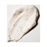 Close-up texture of Green Envee Polishing Facial Scrub showing exfoliating particles in a creamy base for deep pore refinement.