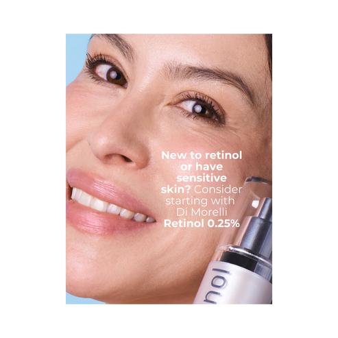Smiling woman holding Di Morelli Retinol Serum 0.25%, recommended for new retinol users and those with delicate or sensitive skin.