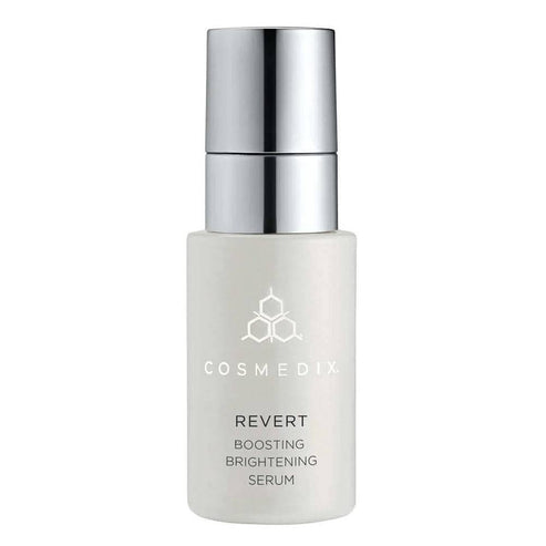 CosMedix Revert Serum - Brightening Boosting face serum in sleek white bottle with silver pump, ideal for reducing age spots and dull skin.