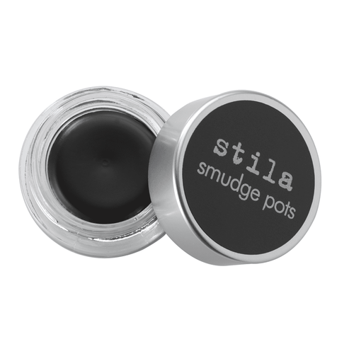 Stila Smudge Pot Jet Black eyeliner in an open round jar with silver lid, ideal for creating sultry eyes and dramatic makeup looks.