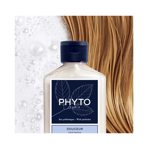 Close-up of Phyto Softness Daily Shampoo on blonde hair with foam. Enhances softness and scalp health with prebiotics for everyday use.