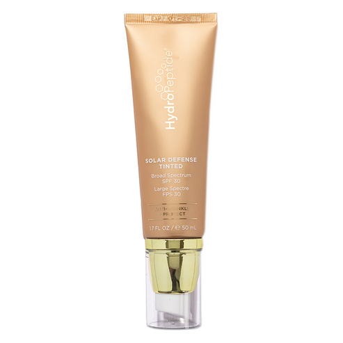 HydroPeptide SPF 30 Tinted sunscreen in a 50ml gold tube with pump dispenser, offering antioxidant-rich broad spectrum sun protection and flawless coverage.