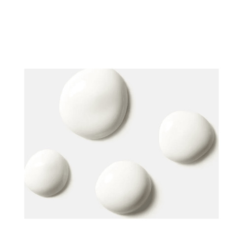 Close-up of HydroPeptide Solar Dew SPF 30 serum texture, highlighting its sheer, milky formula for even skin coverage and sun protection.