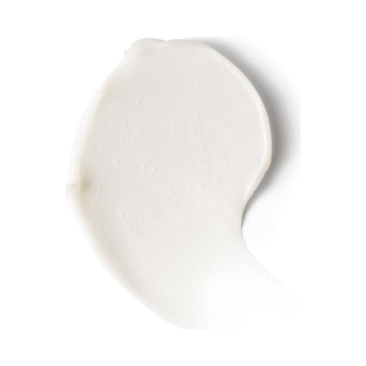 Närbildsstruktur av Biolage Strength Recovery Deep Treatment Pack som visar krämig, rik formel för näring och reparation av torrt hår.