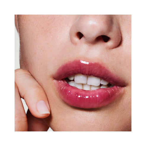 Close-up of glossy lips with lip balm