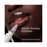 Colorful lip gloss swatches with berry, pink, and yellow shades