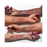 Fresh Sugar Lip Treatments swatched on various skin tones, showcasing Coral and other shades' versatility.