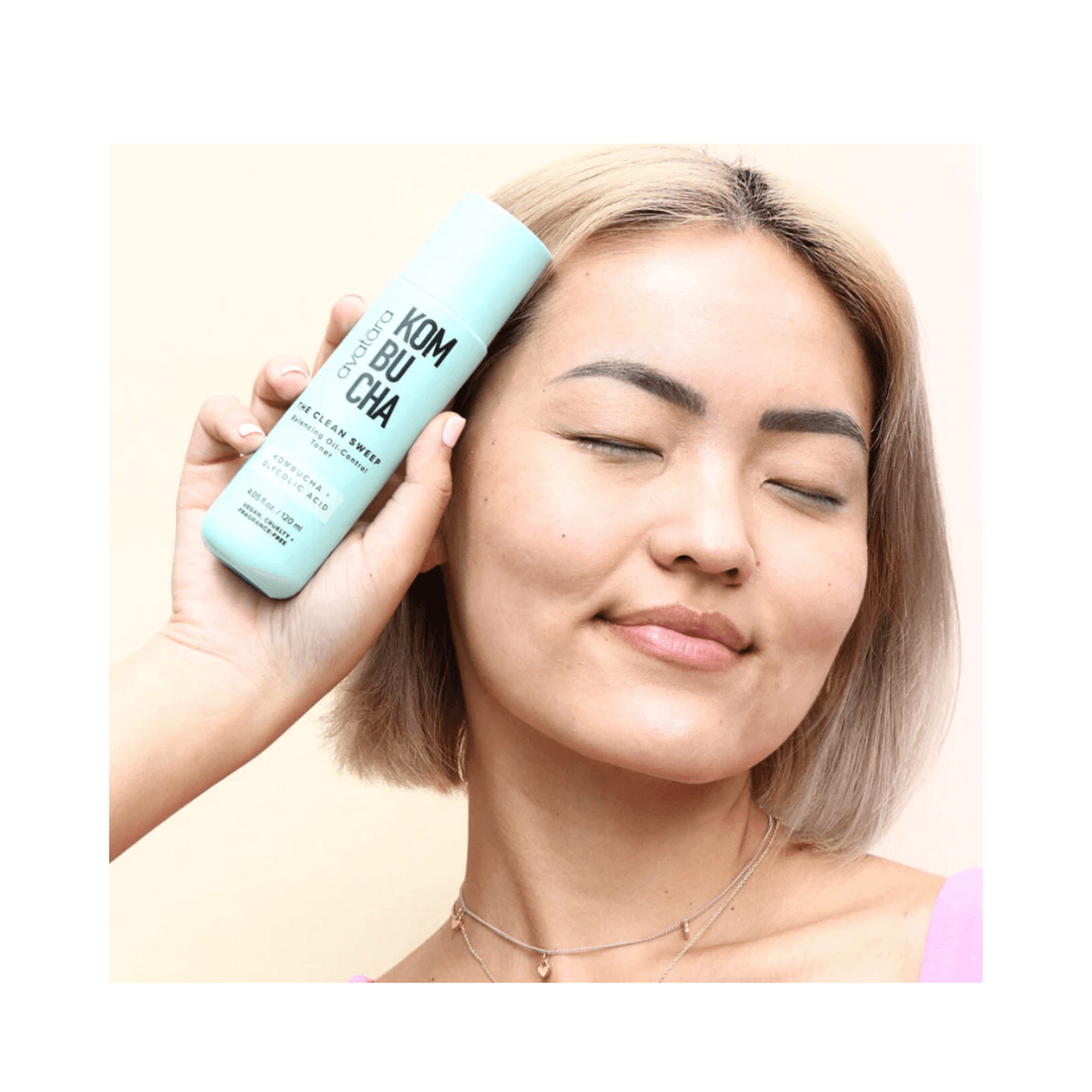 Smiling woman using Avatara The Clean Sweep Toner, promoting clean, balanced skin with this oil-control facial toner.