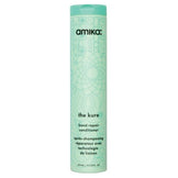 The Kure Bond Repair Conditioner by Amika in a tall mint green bottle with floral design, ideal for repairing and strengthening damaged hair.