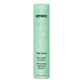 Amika The Kure Shampoo - Bond Repair in mint green bottle, designed for strengthening and repairing damaged hair from heat and chemical treatments.