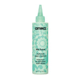 Amika The Kure Repair Treatment bottle with green floral design, ideal for strengthening and reducing hair breakage in hair care routines.
