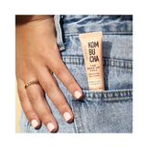 Avatara The Wake-Up Call Eye Cream tucked in denim pocket, portable skincare with Kombucha and Vitamin C for on-the-go eye hydration and brightness.