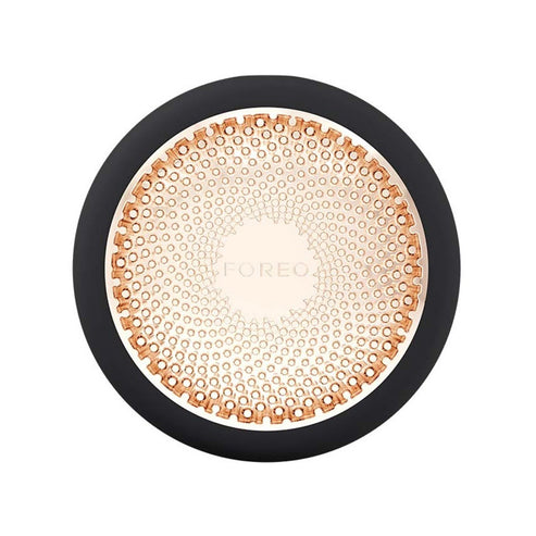 Foreo UFO 3 in black with gold LED plate, a luxury skincare tool for deep hydration and anti-aging facial care.
