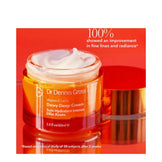 Creamy texture of Dr Dennis Gross Vitamin C + Lactic Dewy Deep Cream in open jar, clinically shown to improve fine lines and radiance.